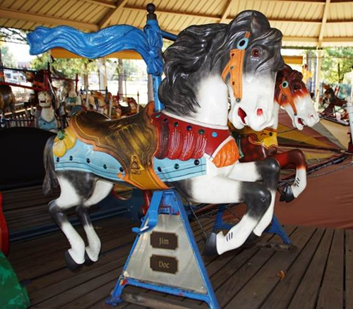 Kids riding carousel